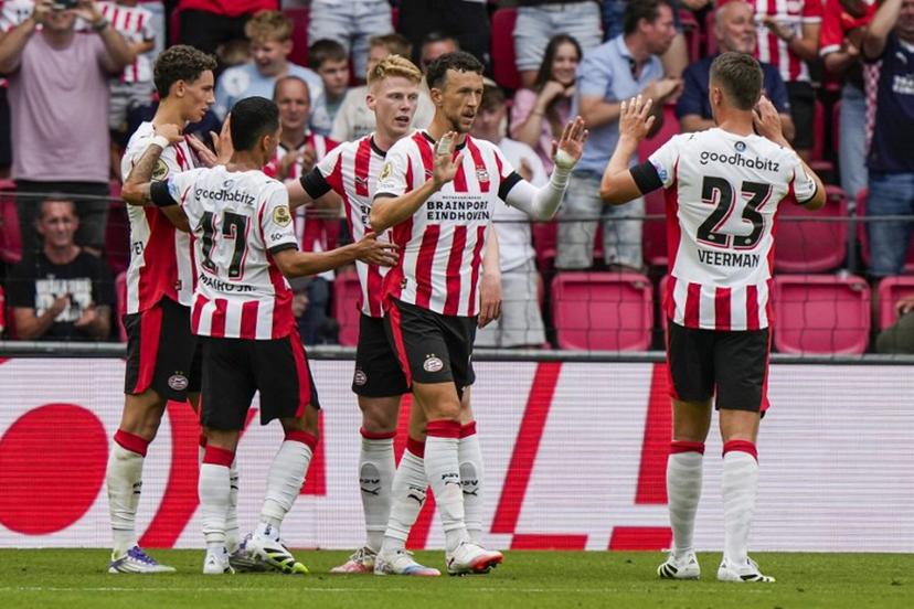 PSV's players celebrate after scoring their team's first goal during the pre-season friendly football match between PSV Eindhoven and Athletic Club Bilbao at the Phillips Stadium in Eindhoven, on July 26, 2025.  Tobias Kleuver / ANP / AFP