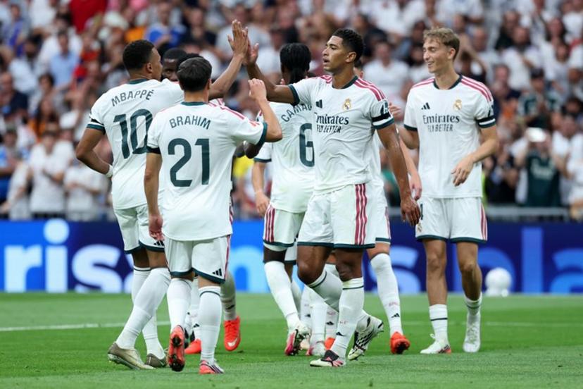 Real Madrid's English midfielder #05 Jude Bellingham celebrates with his teammates Real Madrid's French forward #10 Kylian Mbappe and Real Madrid's Moroccan forward #21 Brahim Diaz after scoring his team's second goal during the Spanish league football match between Real Madrid CF and Malaga CF at Santiago Bernabeu Stadium in Madrid on August 30, 2026.  Thomas COEX / AFP