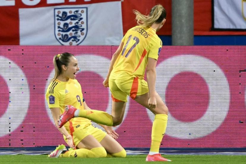 Belgium's forward #09 Tessa Wullaert (L) celebrates scoring her team's third goal during the UEFA Women's Nations League Group A3 football match between Belgium and England at the Den Dreef stadium in Heverlee, outside Leuven, on April 8, 2025.  NICOLAS TUCAT / AFP