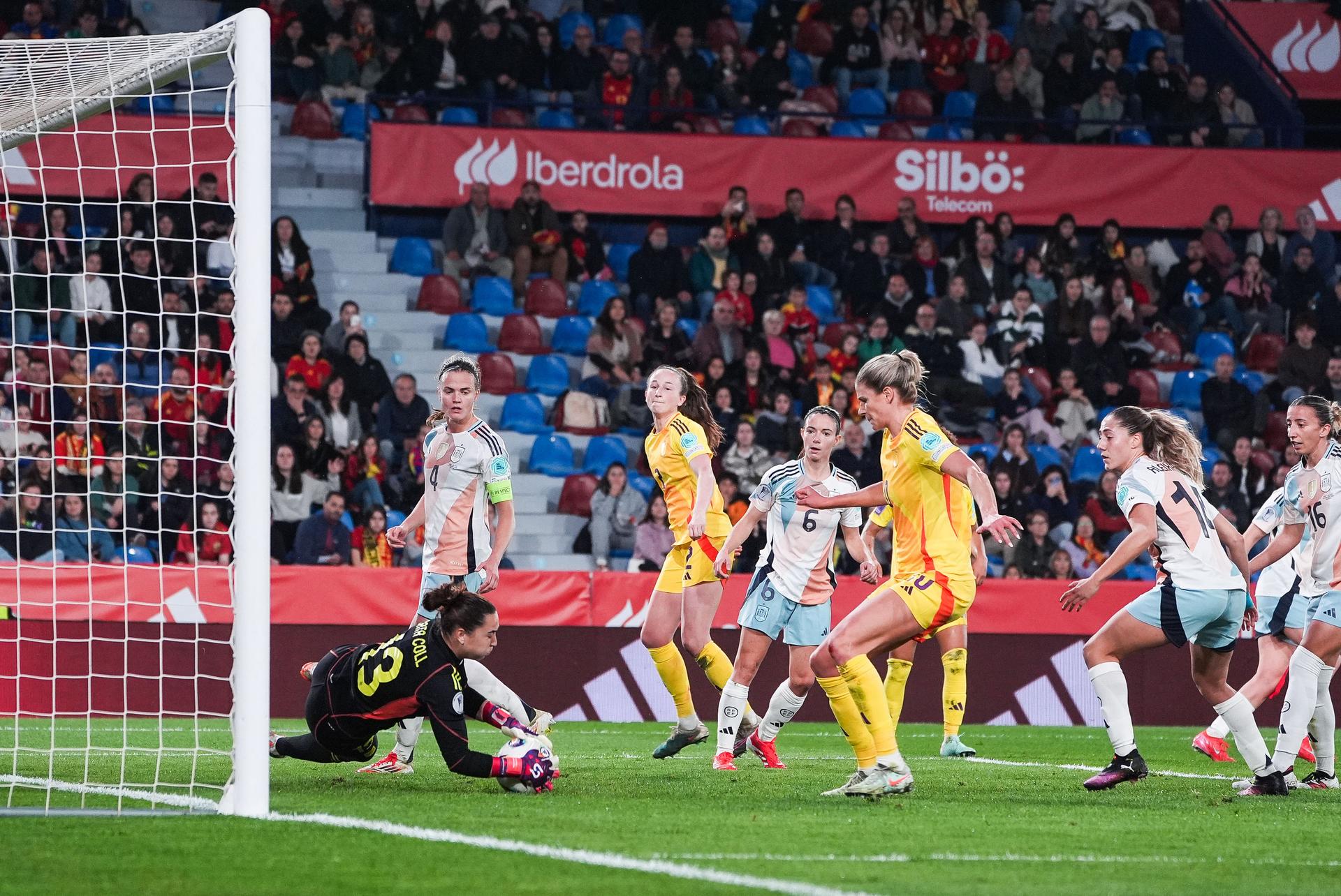 Spain's goalkeeper Catalina Coll and Belgium's Justine Vanhaevermaet pictured in action during a soccer game between Belgium's national team the Red Flames and Spain, in Valencia, Spain Friday 21 February 2025, on the first matchday in group A3 of the 2024-25 Women's Nations League Competition. BELGA PHOTO JOMA GARCIA I GISBERT