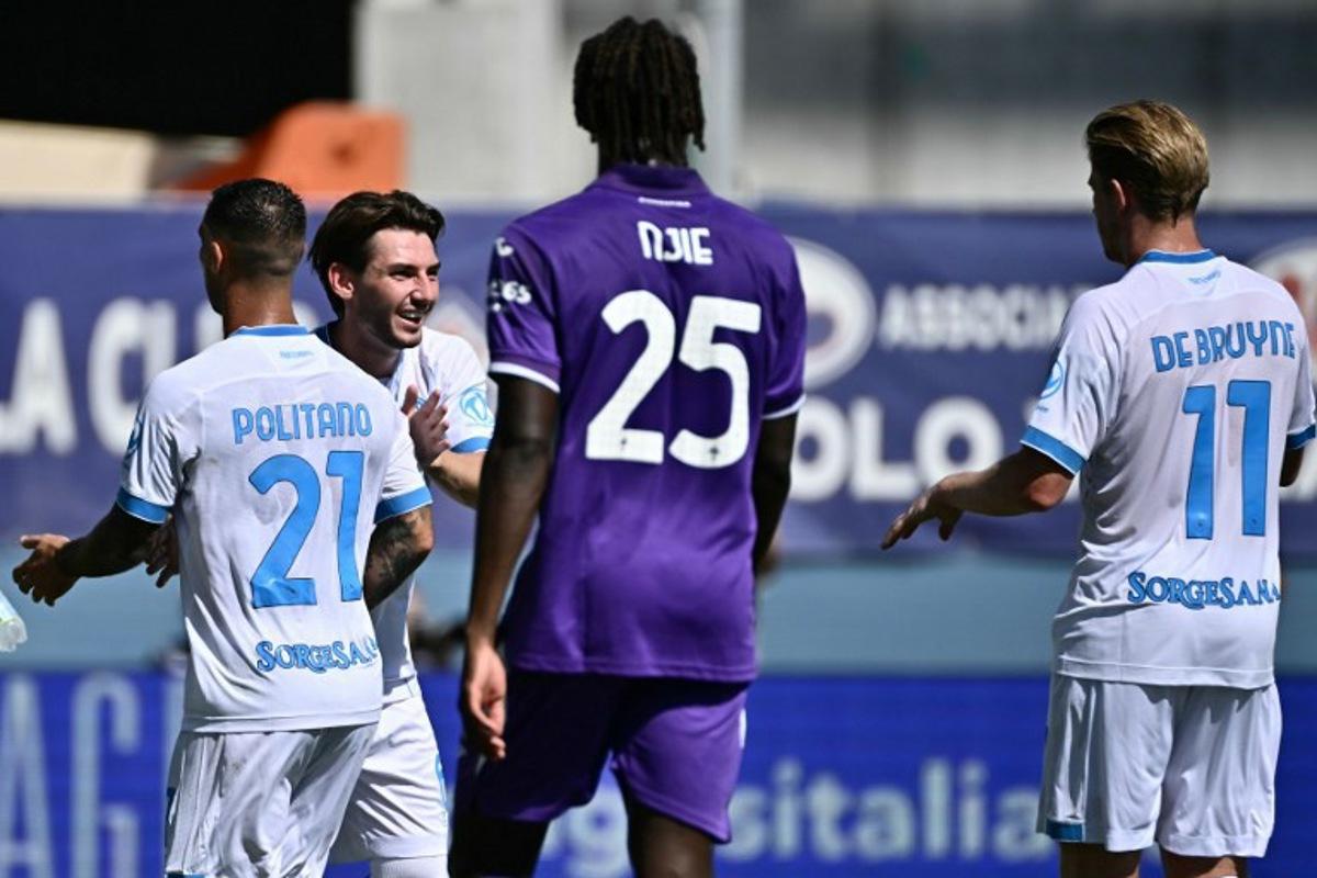 Napoli's Scottish midfielder #06 Billy Gilmour celebrates with teammates after scoring the opening goal during the Italian Serie A football match between Fiorentina and SSC Napoli at the Artemio Franchi stadium in Florence, on September 20, 2026.  Filippo MONTEFORTE / AFP
