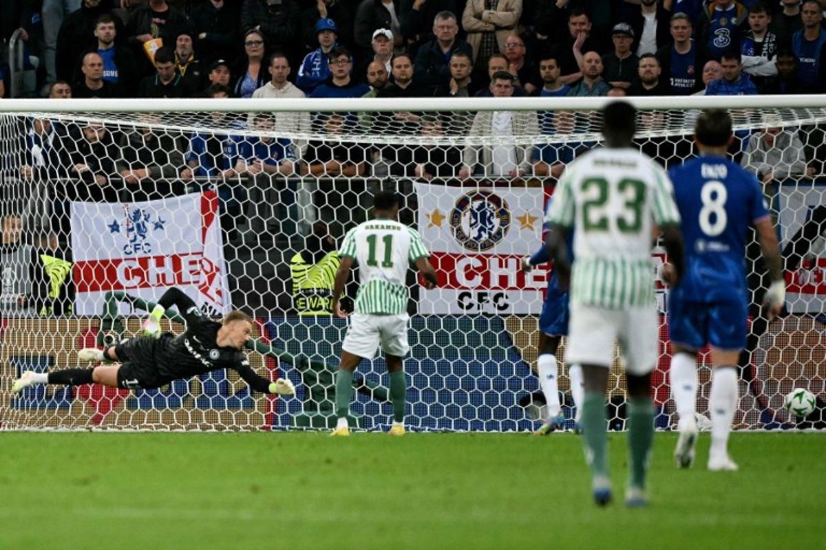 Real Betis' Moroccan forward #10 Abde Ezzalzouli (not pictured) scores his team's first goal past Chelsea's Swedish-Danish goalkeeper #12 Filip Jorgensen (L) during the UEFA Conference League final football match between Real Betis and Chelsea FC in Wroclaw on May 28, 2025.   Sergei GAPON / AFP