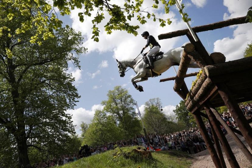 Germany's Christoph Wahler riding Carjatan S jumps the Ford Broken Bridge fence during the cross-country test of the Badminton Horse Trials in Badminton, central England on May 7, 2022.  ADRIAN DENNIS / AFP