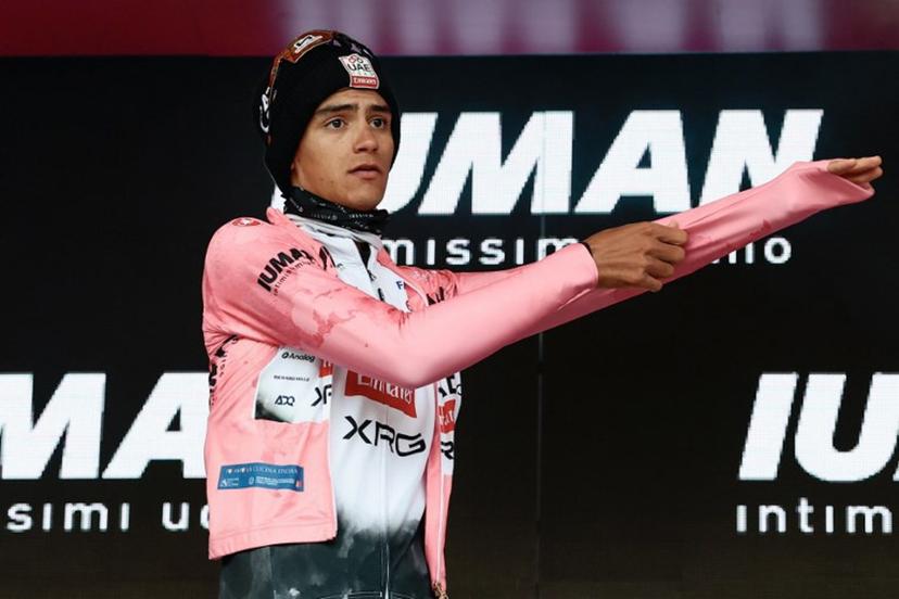 UAE Team Emirates XRG's Mexican rider Isaac Del Toro wears the pink jersey of overall leader (Maglia Rosa) on the podium after the 14th stage of the 108th Giro d'Italia cycling race of 195kms from Treviso in Italy to Nova Gorica in Slovenia on May 24, 2025.  Luca Bettini / AFP