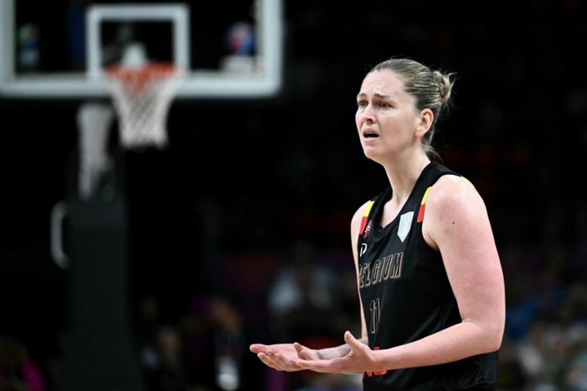 Belgium's power forward Emma Meesseman reacts on the floor during the FIBA Women's EuroBasket 2025 final match between Spain and Belgium at the Peace and Friendship Stadium in Athens on June 29, 2025.  Aris MESSINIS / AFP