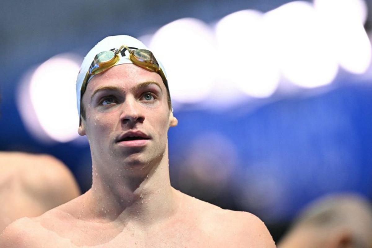 France's swimmer Leon Marchand reacts after a heat of the men's 400m individual medley swimming event during the 2025 World Aquatics Championships in Singapore on August 3, 2025.  MANAN VATSYAYANA / AFP