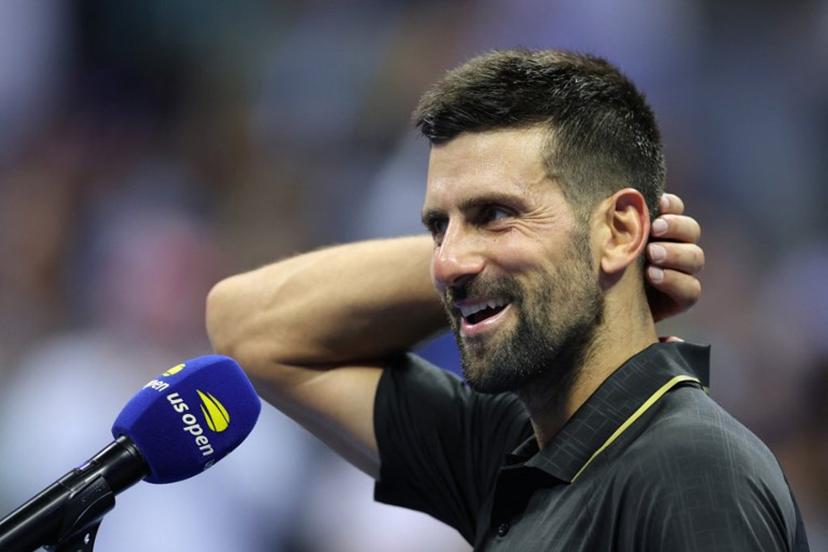Serbia's Novak Djokovic speaks during a post-match interview after winning his men's singles first round tennis match against USA's Learner Tien on day one of the US Open tennis tournament at the USTA Billie Jean King National Tennis Center in New York City, on August 24, 2025.  CHARLY TRIBALLEAU / AFP