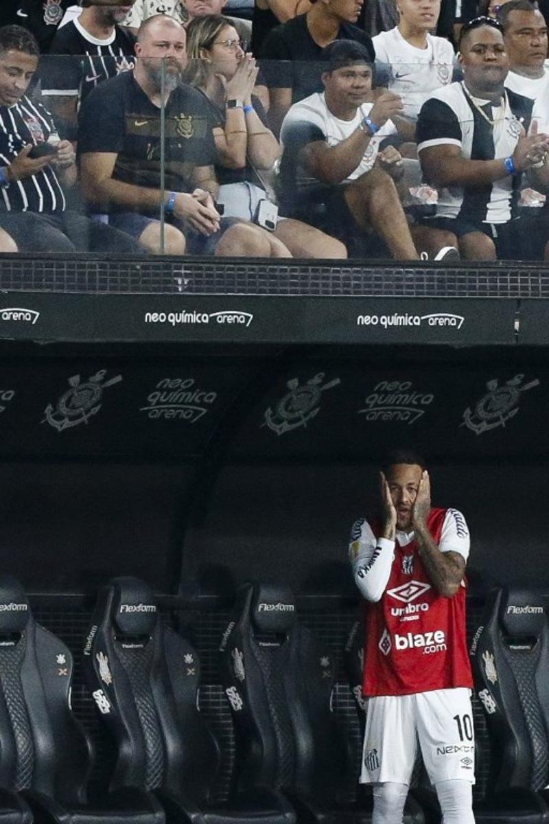 Santos forward #10 Neymar reacts from the bench during Campeonato Paulista A1 semi-final football match between Corinthians and Santos at Arena Corinthians in Sao Paulo on March 9, 2025.  Miguel SCHINCARIOL / AFP