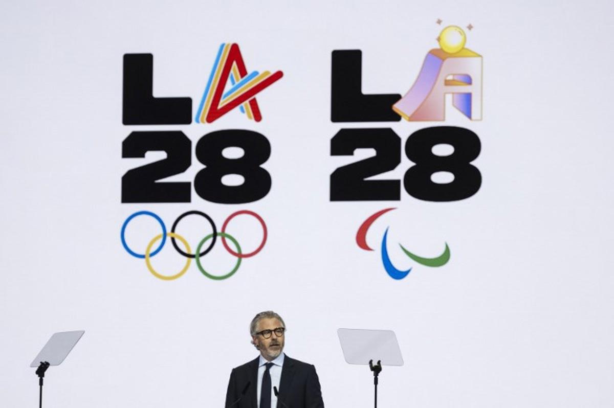 Los Angeles 2028 Olympics chairman, Casey Wasserman speaks during the presentation of an activities report during the 144th session of the International Olympic Committee (IOC), in Costa Navarino, Greece, on the election day of the next IOC President, on March 20, 2025.    Fabrice COFFRINI / AFP