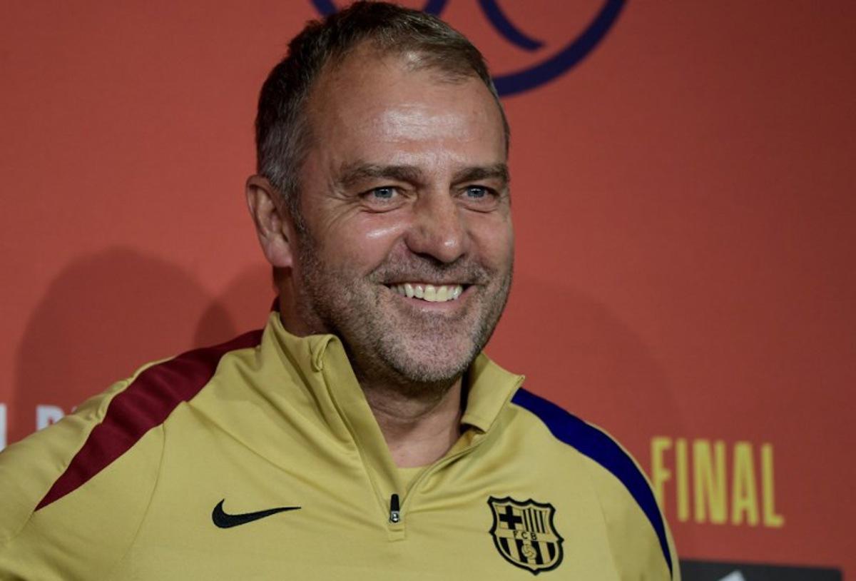 Barcelona's German coach Hans-Dieter Flick smiles during a press conference at La Cartuja stadium on the eve of their Spanish Cup (King's Cup) final between FC Barcelona and Real Madrid CF in Seville, on April 25, 2025.  CRISTINA QUICLER / AFP
