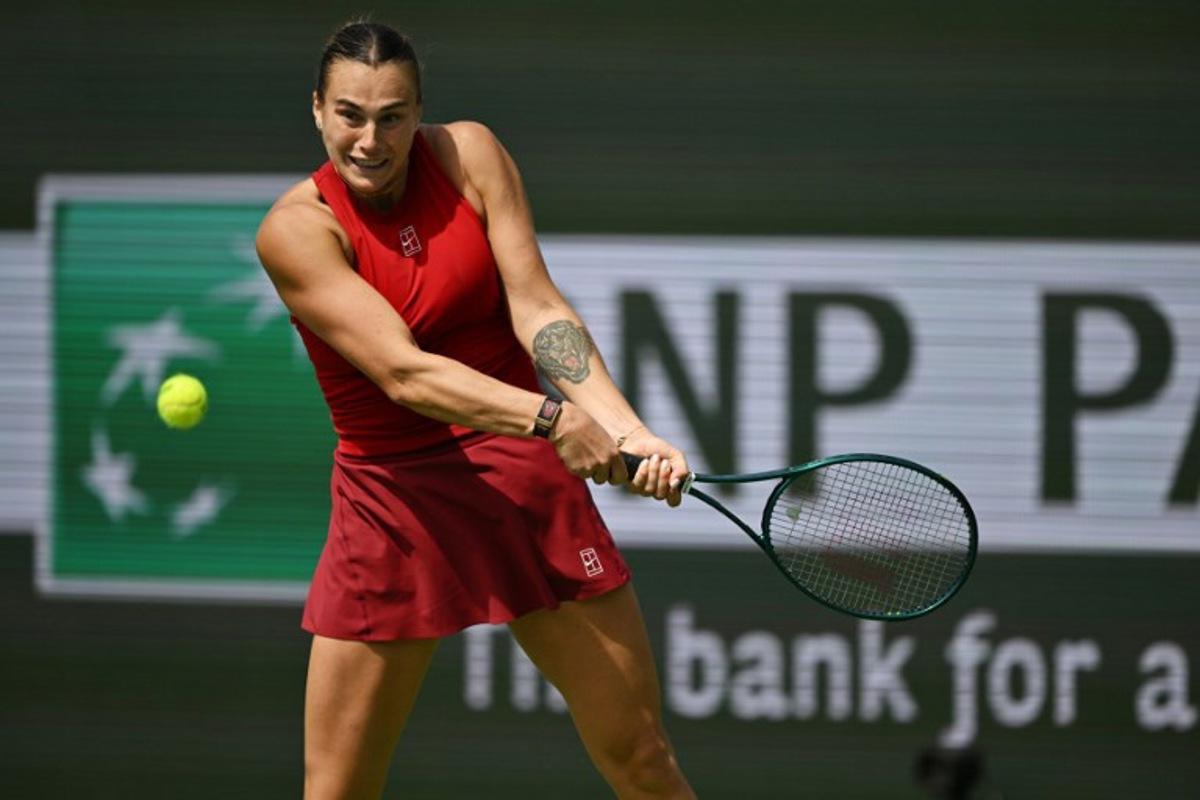 Belarus' Aryna Sabalenka returns the ball to Russia's Mirra Andreeva during the women's singles final tennis match at the BNP Paribas Open at the Indian Wells Tennis Garden in Indian Wells, California, on March 16, 2025.  Patrick T. Fallon / AFP