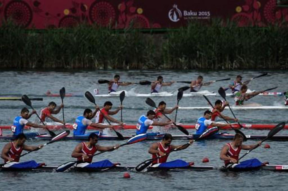 Athletes compete in the kayak four (K4) 1000m men's final at the 2015 European Games in Mingachevir, some 300 km from Baku, on June 16, 2015. AFP PHOTO / KIRILL KUDRYAVTSEV