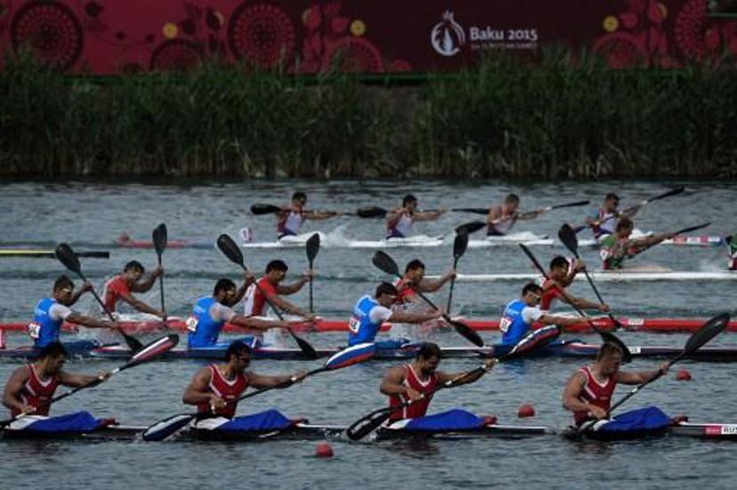 Athletes compete in the kayak four (K4) 1000m men's final at the 2015 European Games in Mingachevir, some 300 km from Baku, on June 16, 2015. AFP PHOTO / KIRILL KUDRYAVTSEV