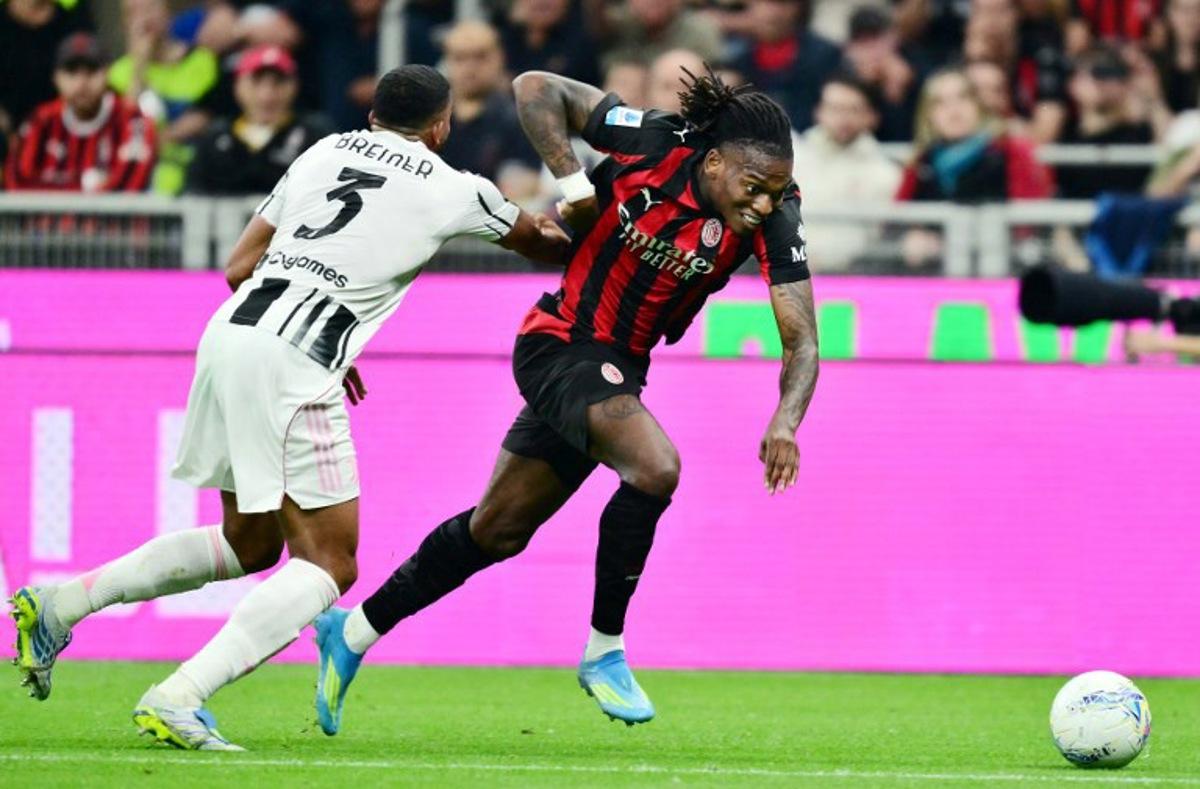 AC Milan's Portuguese forward #10 Rafael Leao (R) fights for the ball with Juventus' Brazilian defender #03 Bremer during the Italian Serie A football match between AC Milan and Juventus FC at the San Siro stadium in Milan, northern Italy, on April 26, 2026.  Stefano RELLANDINI / AFP