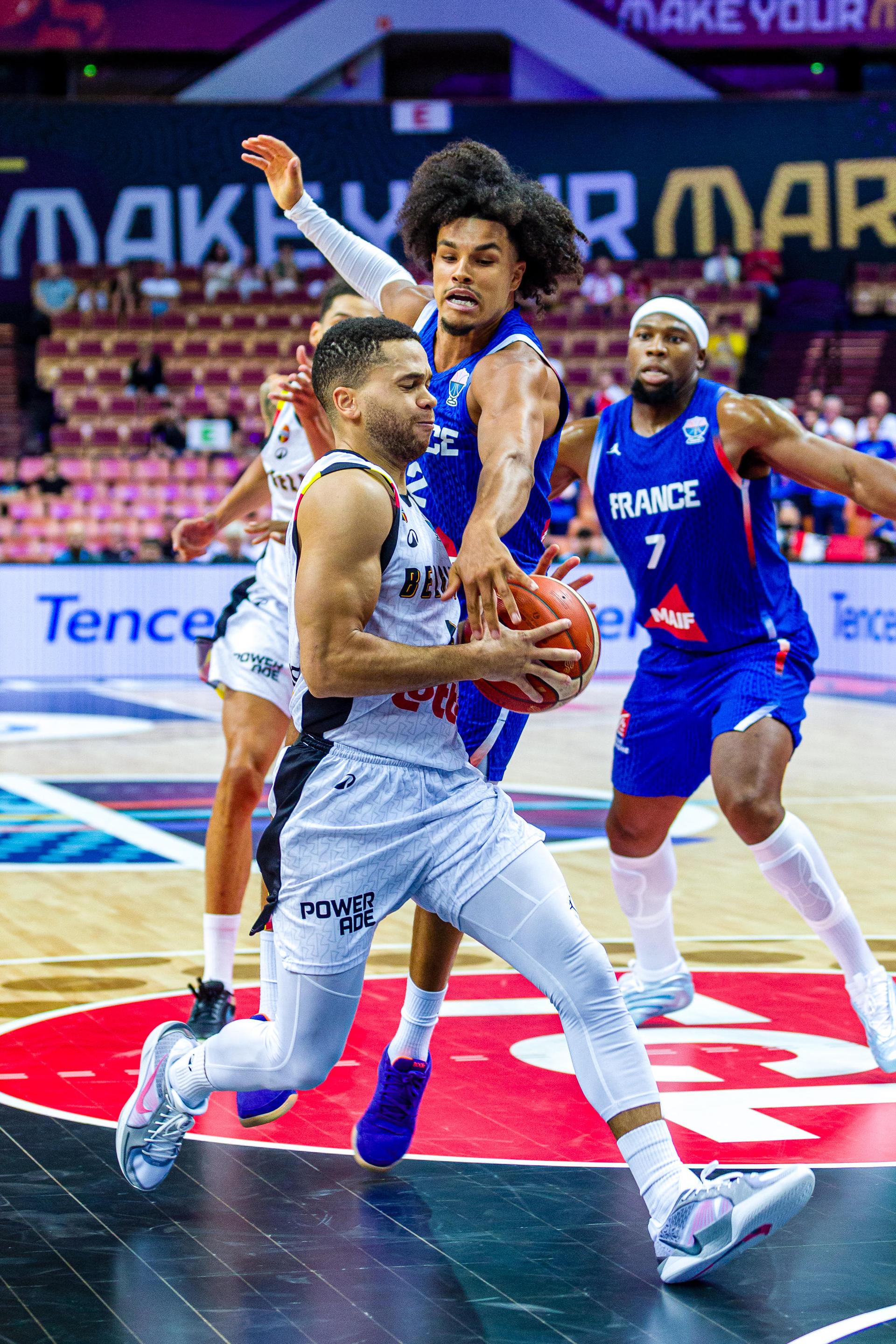 Belgium's Emmanuel Manu Lecomte and French Nadir Hifi pictured in action during a basketball match between Belgium's national team Belgian Lions and France, Thursday 28 August 2025 in Katowice, Poland, the first game of the group stage of the Eurobasket 2025 European championships. BELGA PHOTO PAWEL PIETRANIK *** BELGIUM ONLY ***