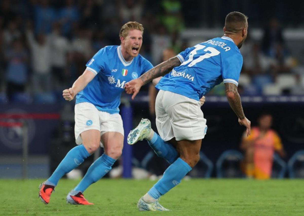 Napoli's Italian defender #37 Leonardo Spinazzola (R) celebrates after scoring his team's second goal during the Italian Serie A football match between SSC Napoli and Pisa SC at the Diego Armando Maradona Stadium in Naples on September 22, 2025.  CARLO HERMANN / AFP