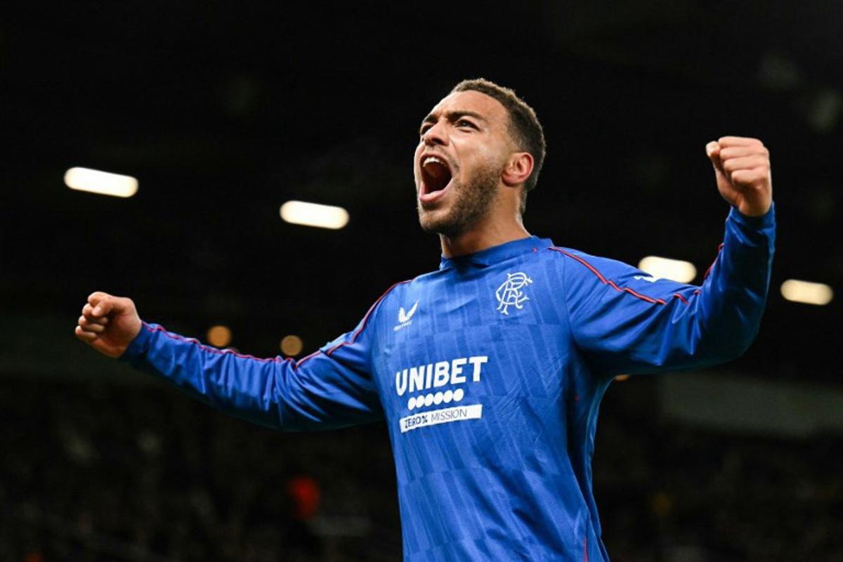 Rangers' Belgian-born Nigerian striker #09 Cyriel Dessers celebrates after scoring his team first goal during the UEFA Europa league football match between Manchester United and Glasgow Rangers at Old Trafford stadium in Manchester, north west England, on January 23, 2025.  Oli SCARFF / AFP