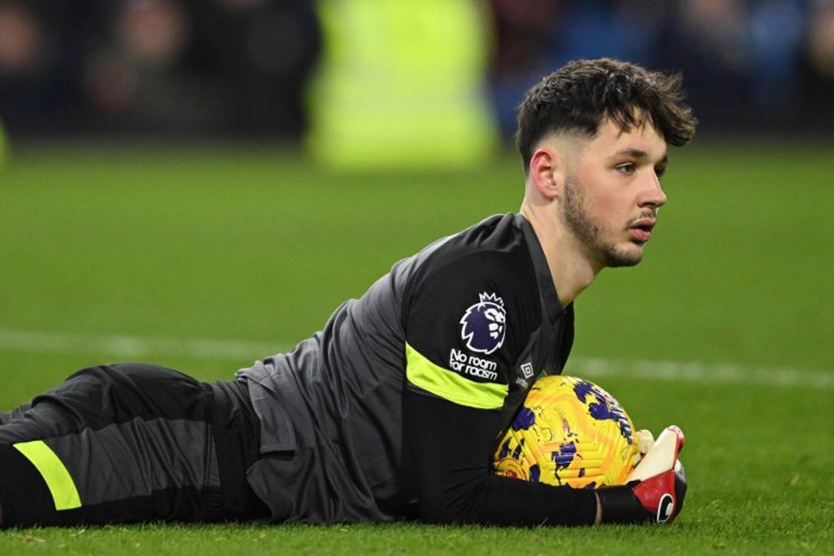 Burnley's English goalkeeper #01 James Trafford gathers the ball during the English Premier League football match between Burnley and Luton Town at Turf Moor in Burnley, north-west England on January 12, 2024.  Oli SCARFF / AFP
