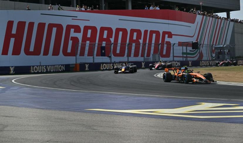 McLaren's British driver Lando Norris competes ahead of Red Bull Racing's Dutch driver Max Verstappen, Ferrari's British driver Lewis Hamilton, and Ferrari's Monegasque driver Charles Leclerc during the Formula One Hungarian Grand Prix at the Hungaroring racetrack in Mogyorod near Budapest, Hungary, on July 26, 2026.  Andrej ISAKOVIC / AFP