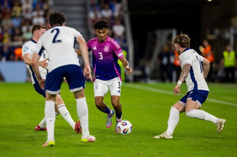Germany's defender #03 Nathaniel Brown (2nd R) vies for the ball with England's midfielder #08 Elliot Anderson (L), England's defender #02 Tino Livramento (2nd L) and England's forward #19 Harvey Elliott (R) during the UEFA U21 European Championship final football match between England and Germany in Bratislava, Slovakia on June 28, 2025.  Branislav Racko / AFP
