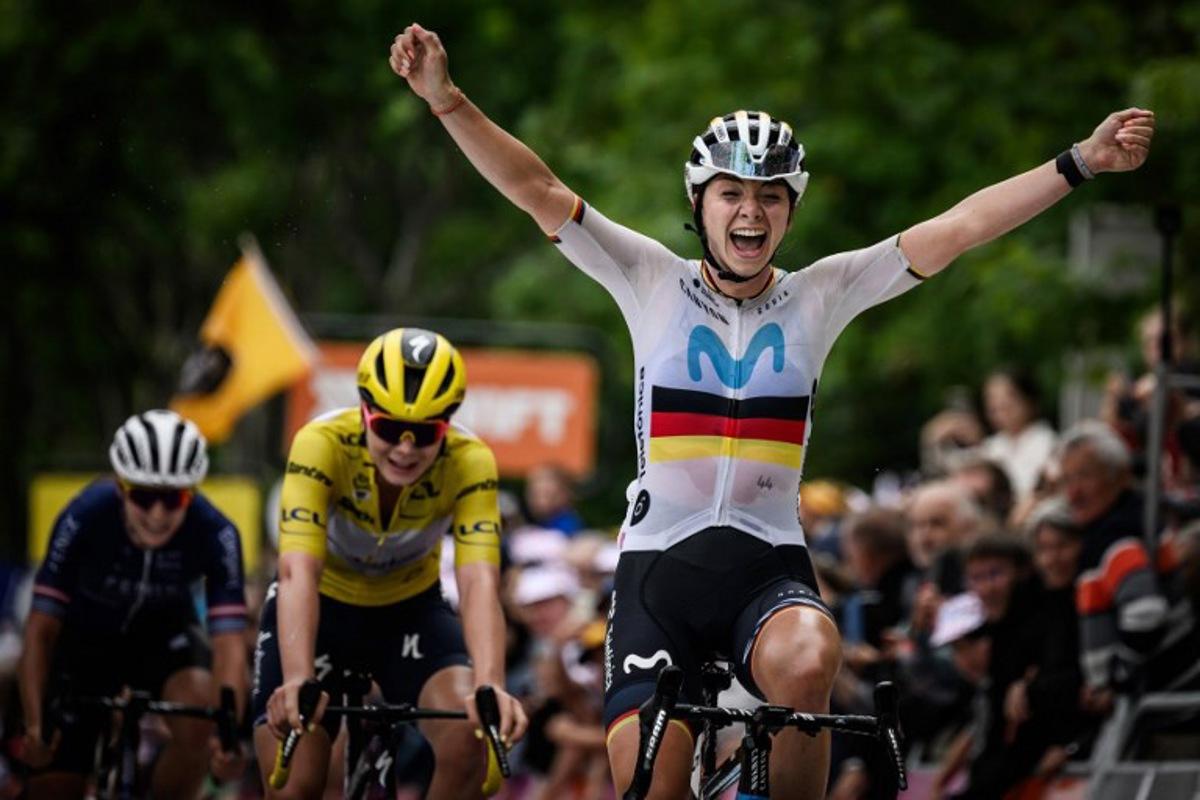 Movistar's German rider Liane Lippert (R), flanked by stage's 2nd placed, Yellow jersey of overall leader, SD Worx' Belgian rider Lotte Kopecky (C), crosses the finish line as she wins the second stage (out of 8) of the second edition of the Women's Tour de France cycling race 151 km between Clermont-Ferrand and Mauriac, in the Auvergne-Rhone-Alpes region, south-eastern France, on July 24, 2023.  Jeff PACHOUD / AFP