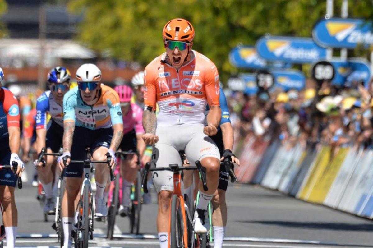 Ineos Grenadiers rider Sam Welsford from Australia celebrates winning stage three of the Tour Down Under UCI Men's Cycling race in Adelaide on January 23, 2026.  Brenton Edwards / AFP