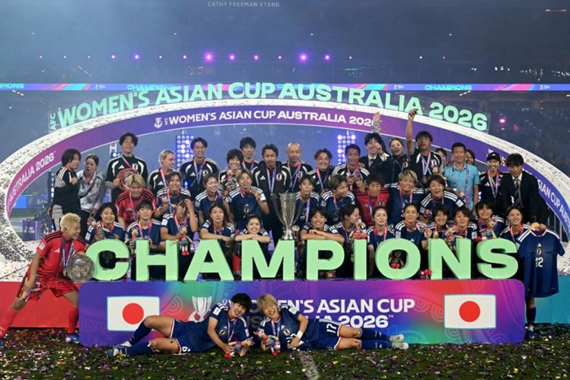 Japan's team celebrate with the trophy after winning the final of the AFC Women's Asian Cup Australia 2026 football tournament between Australia and Japan at Stadium Australia in Sydney on March 21, 2026.  Saeed Khan / AFP
