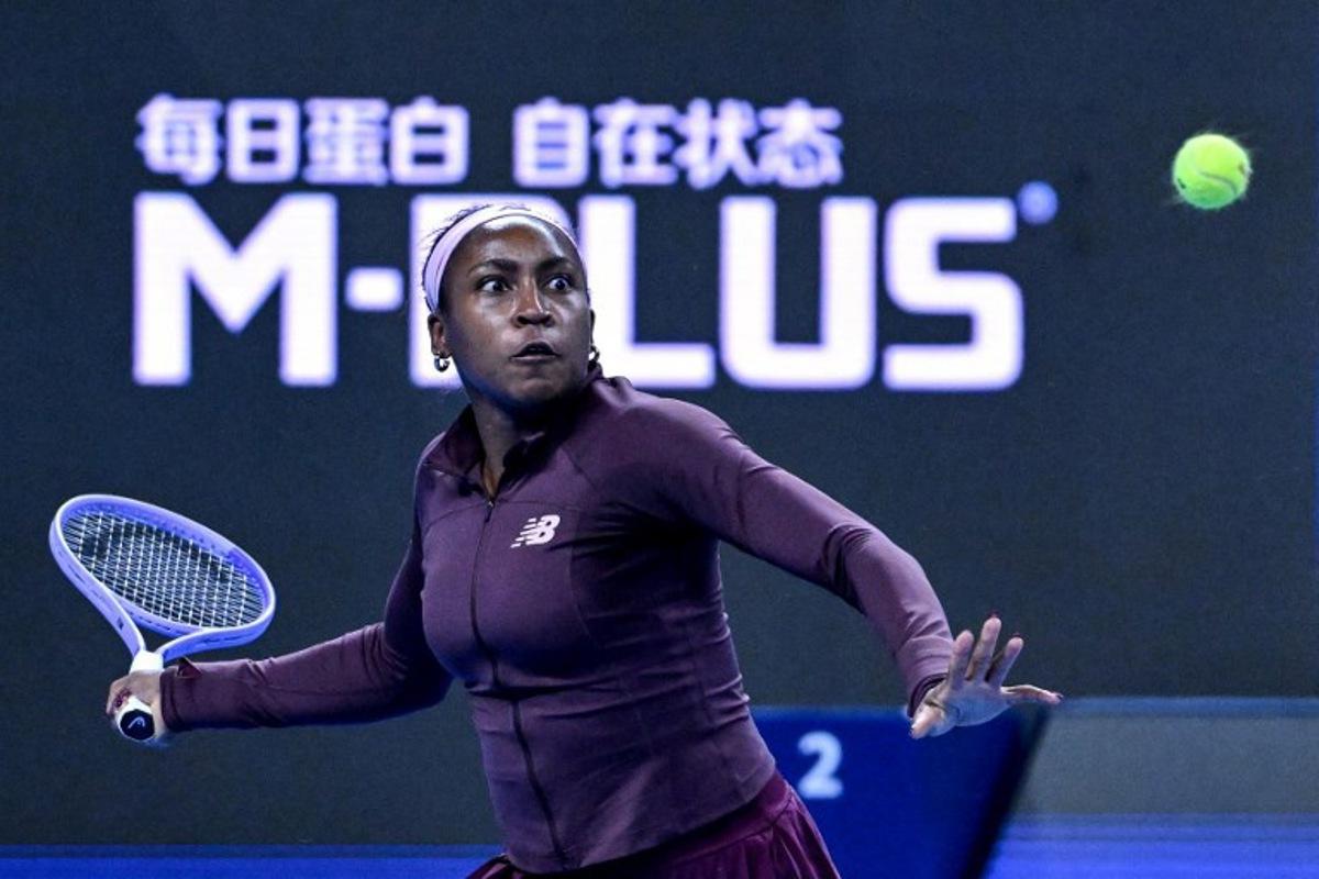 USA's Coco Gauff hits a return to China's Sun Xinran during their women's singles match at the China Open tennis tournament in Beijing on October 5, 2026.  ADEK BERRY / AFP