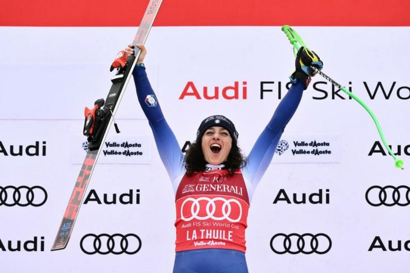 Italy's Federica Brignone celebrates on the podium of the Women's Super G replacing St Moritz event of FIS Alpine Skiing World Cup in La Thuile, Italy on March 14, 2025. Italy's Federica Brignone won the race ahead of Italy's Sofia Goggia and France's Romane Miradoli, third. A sensational run from Brignone gave her victory in the Italian alps by just 0.01sec over her compatriot Sofia Goggia. It extended her lead in the overall standings on Lara Gut-Behrami to 382 points.  Marco BERTORELLO / AFP