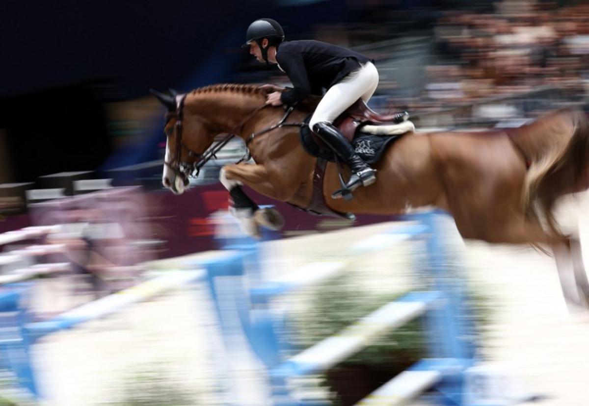 Belgium's Pieter Devos riding Jade V Bisschop competes during the "Le Saut Hermes CSI 5*" International Jumping Competition at the Grand Palais Ephemere in Paris, on March 16, 2024.  FRANCK FIFE / AFP