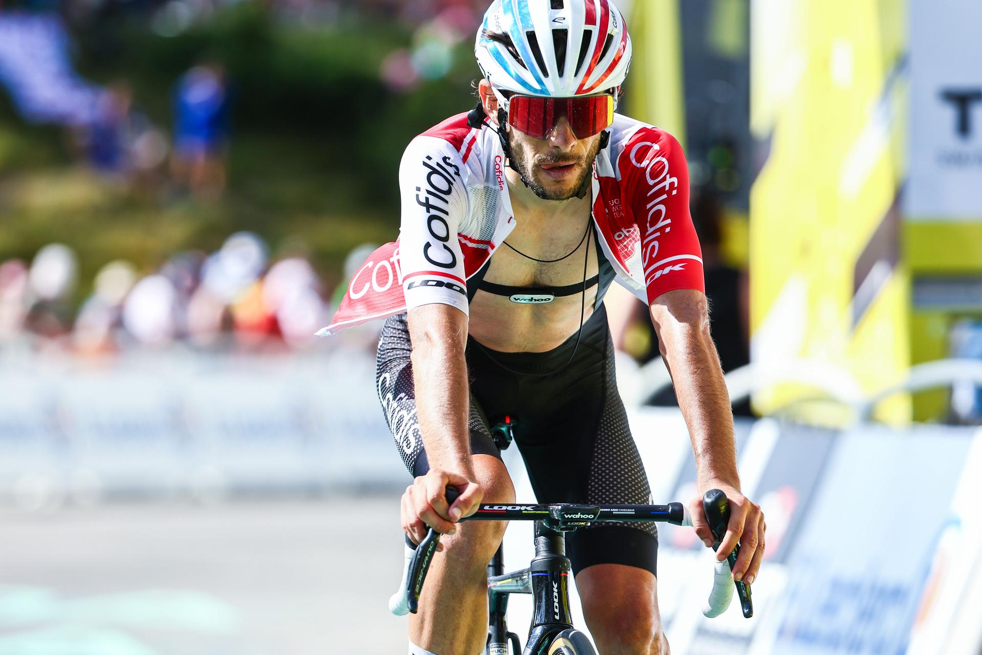 French Guillaume Martin of Cofidis pictured as he crosses the finish line at stage 15 of the 2024 Tour de France cycling race, from Loudenvielle to Plateau de Beille, France (107,7 km), on Sunday 14 July 2024. The 111th edition of the Tour de France starts on Saturday 29 June and will finish in Nice, France on 21 July. BELGA PHOTO DAVID PINTENS