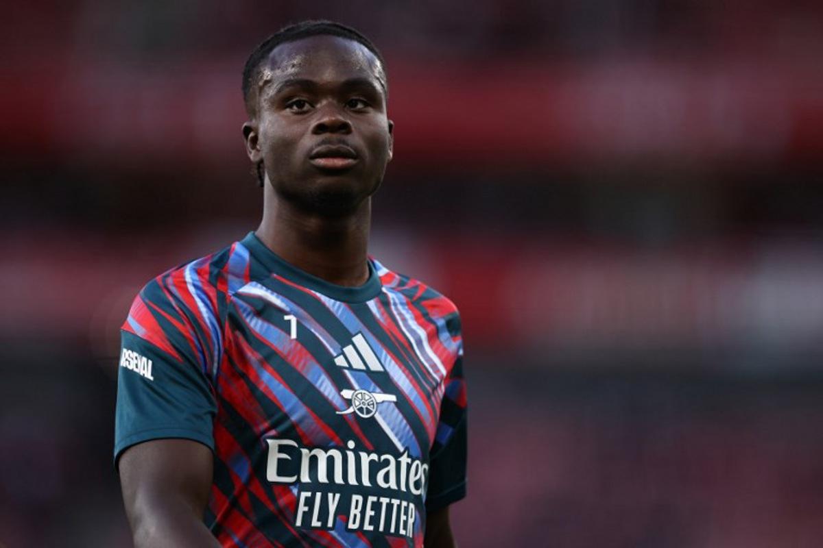 Arsenal's English midfielder #07 Bukayo Saka warms up ahead of the English Premier League football match between Arsenal and Coventry City at the Emirates Stadium in London on August 21, 2026.   Henry NICHOLLS / AFP