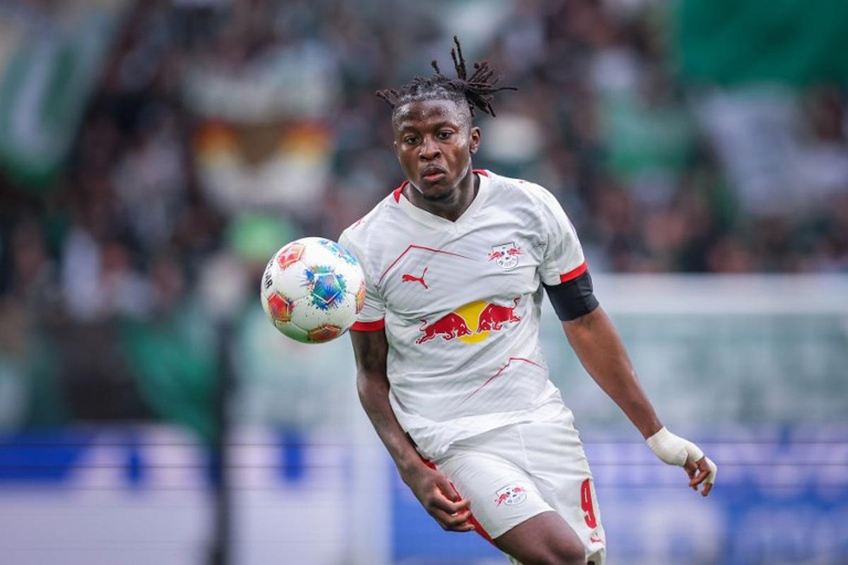 Leipzig's Belgian forward #09 Johan Bakayoko plays the ball during the German first division Bundesliga football match between VfL Wolfsburg and RB Leipzig in Wolfsburg, northern Germany on September 27, 2025.  RONNY HARTMANN / AFP