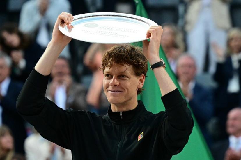 Italy's Jannik Sinner shows his finalist trophy at the end of his men's singles final match against Spain's Carlos Alcaraz  for the ATP Rome Open tennis tournament at Foro Italico in Rome on May 18, 2025.   Tiziana FABI / AFP