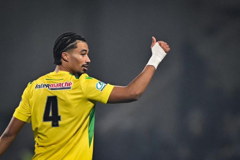 Nantes' French defender #44 Nathan Zeze celebrates after scoring the team's third tryduring the French Cup round of 64 football match between Drancy JA and FC Nantes, at the Bauer Stadium in Saint-Ouen, outside Paris, on December 21, 2024.  Lou BENOIST / AFP