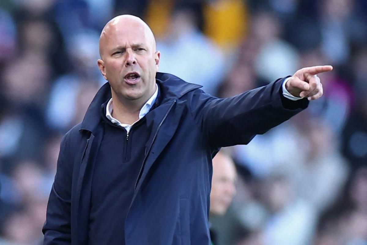 Liverpool's Dutch manager Arne Slot gestures on the touchline during the English Premier League football match between Fulham and Liverpool at Craven Cottage in London on April 6, 2025.  HENRY NICHOLLS / AFP