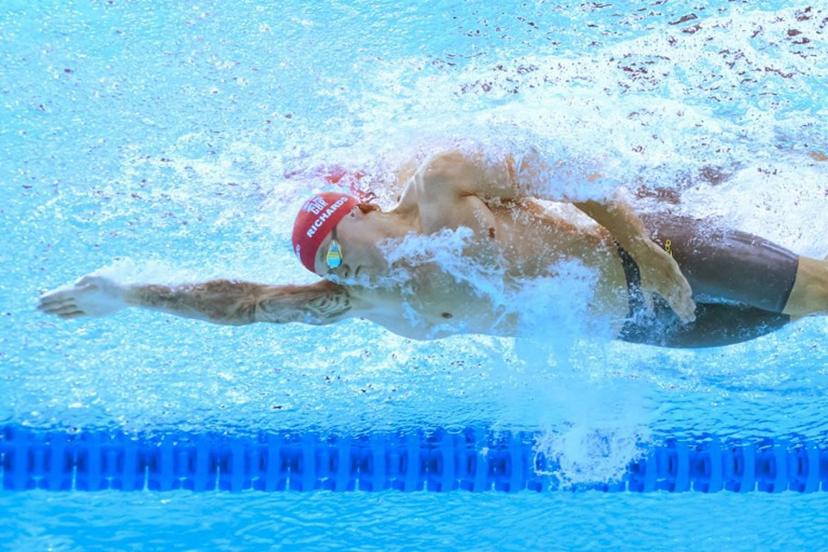 An underwater view shows Britain's swimmer Matthew Richards as he competes in  a heat of the men's 100m freestyle swimming event during the 2025 World Aquatics Championships in Singapore on July 30, 2025.  FRANCOIS-XAVIER MARIT / AFP