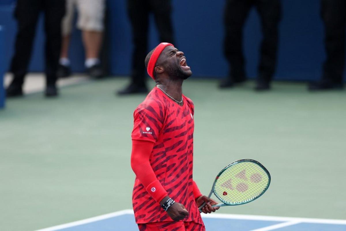 USA's Frances Tiafoe celebrates his victory over USA's Martin Damm Jr. during their men's singles second round tennis match on day four of the US Open tennis tournament at the USTA Billie Jean King National Tennis Center in New York City, on August 27, 2025.  CHARLY TRIBALLEAU / AFP