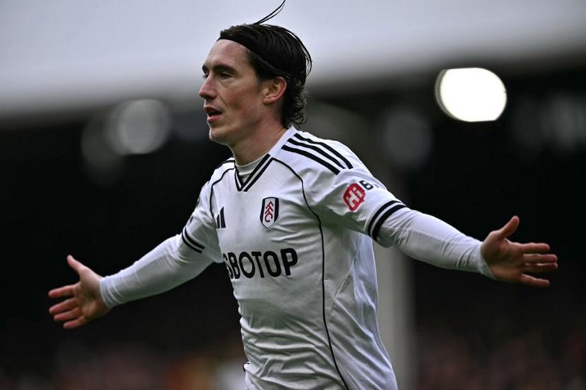 Fulham's Welsh midfielder #08 Harry Wilson celebrates after scoring the opening goal during the English Premier League football match between Fulham and Tottenham Hotspur at Craven Cottage in London on March 1, 2026.  Ben STANSALL / AFP