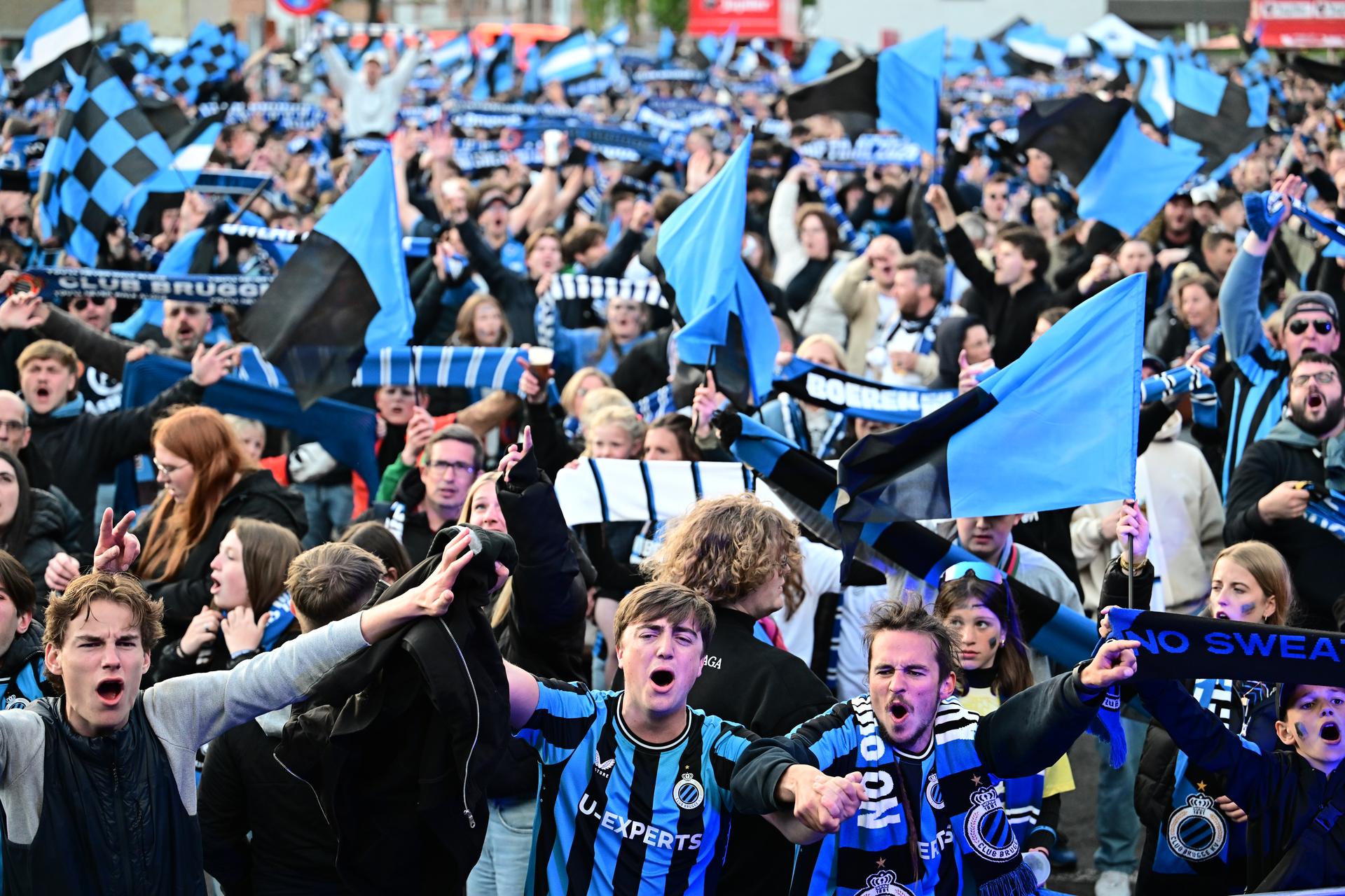 Fans celebrate the victory of Club Brugge, at a supporters village (fandorp) on the parking of Brugge stadium, during the final of the 'Croky Cup' Belgian soccer cup, between Club Brugge and RSC Anderlecht, Sunday 04 May 2025. BELGA PHOTO MAARTEN STRAETEMANS