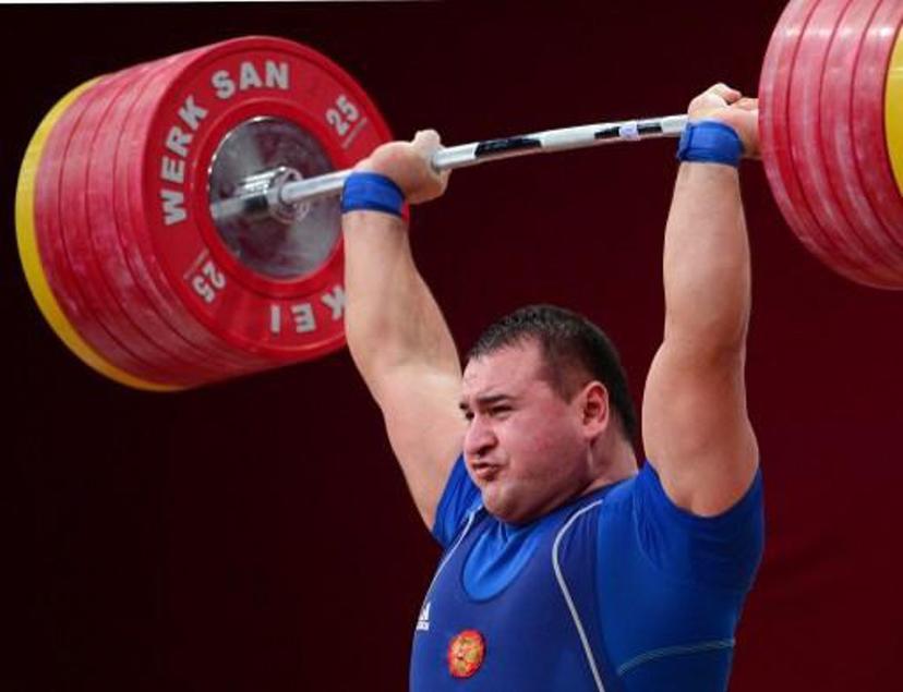 Ruslan Albegov of Russia competes in the men's +105 kg weightlifting IWF World Championships at Centennial Hall in Wroclaw, Poland on October 27, 2013. Ruslan Albegov won the gold medal in the competition. AFP PHOTO/JANEK SKARZYNSKI