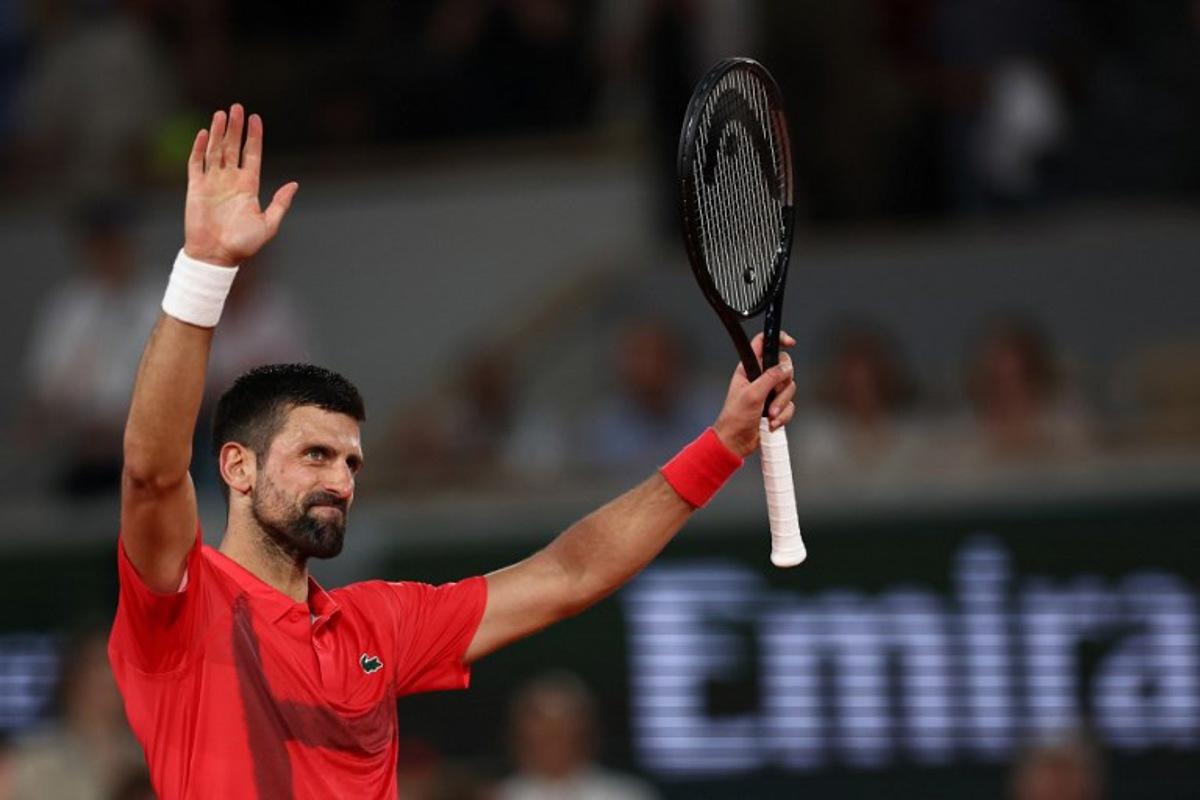 Serbia's Novak Djokovic celebrates his victory over Austria's Filip Misolic during their men's singles match on day 7 of the French Open tennis tournament on Court Philippe-Chatrier at the Roland-Garros Complex in Paris on May 31, 2025.  Anne-Christine POUJOULAT / AFP