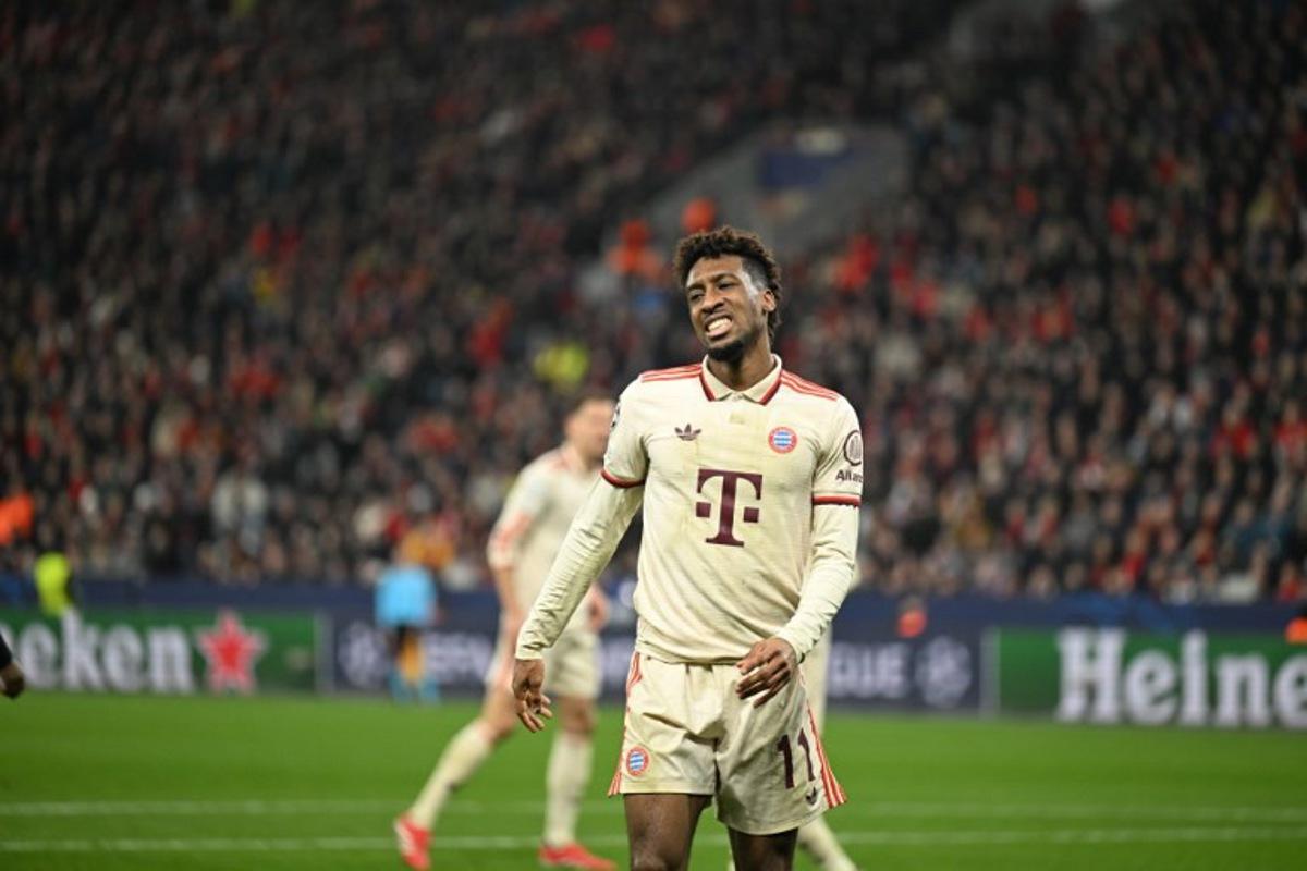 Bayern Munich's French forward #11 Kingsley Coman reacts injured during the UEFA Champions League last 16, second leg, football match between Bayer Leverkusen and Bayern Munich in Leverkusen, western Germany on March 11, 2025.   INA FASSBENDER / AFP