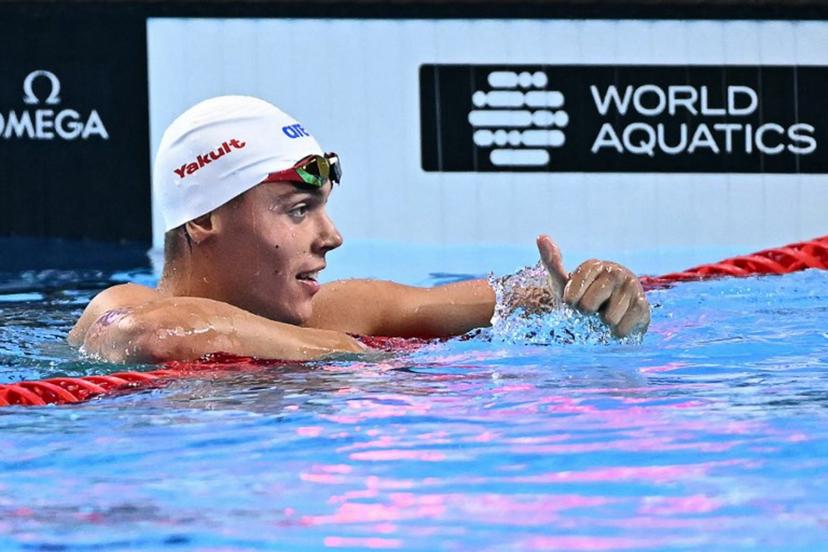 Romania's swimmer David Popovici reacts after competing a semi-final of the men's 100m freestyle swimming event during the 2025 World Aquatics Championships in Singapore on July 30, 2025.  MANAN VATSYAYANA / AFP