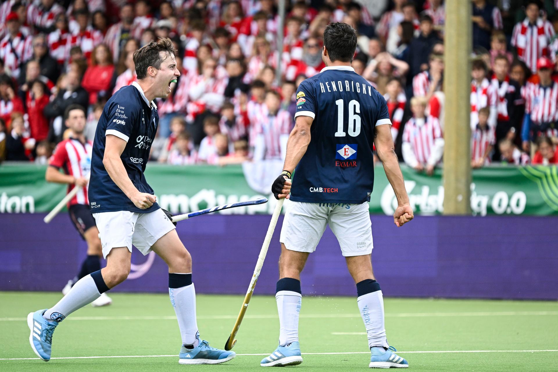 Gantoise's Sean Murray and Gantoise's Alexander Hendrickx celebrate after scoring during a hockey game between Royals Leopold Club and Gantoise, Sunday 25 May 2025 in Antwerp, the second leg game in the finals of the men's 2024-2025 Belgian first division hockey championship. BELGA PHOTO TOM GOYVAERTS