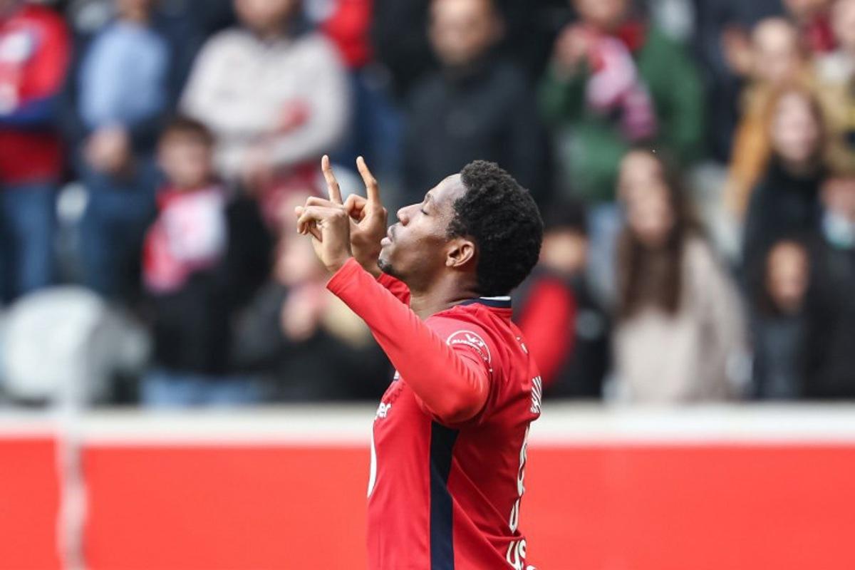 Lille's Canadian forward #09 Jonathan David celebrates scoring his team's third goal during the French L1 football match between Lille LOSC and AJ Auxerre at Stade Pierre-Mauroy in Villeneuve-d'Ascq, northern France on April 20, 2025.  Sameer Al-DOUMY / AFP