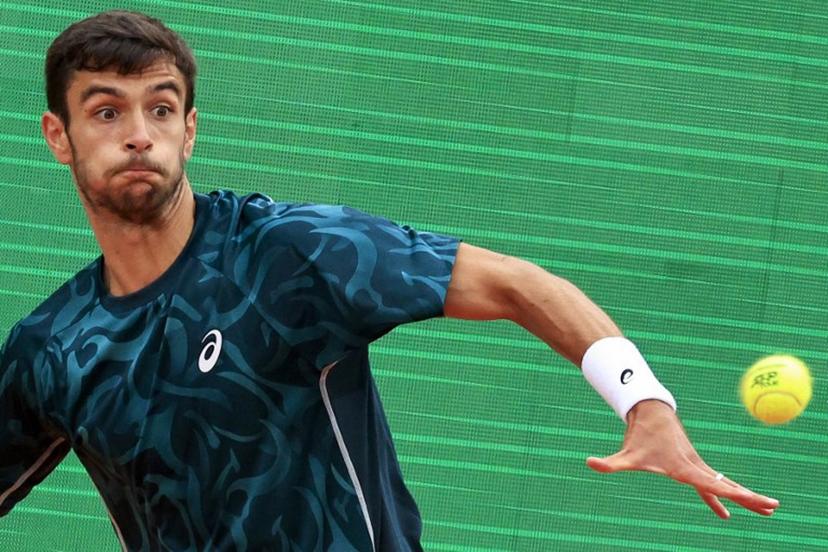 Italy's Lorenzo Musetti eyes the ball as he plays against Australia's Alex De Minaur during the Monte Carlo ATP Masters Series Tournament semi-final tennis match at the Monte Carlo Country Club in Roquebrune-Cap-Martin on April 12, 2025.  Valery HACHE / AFP