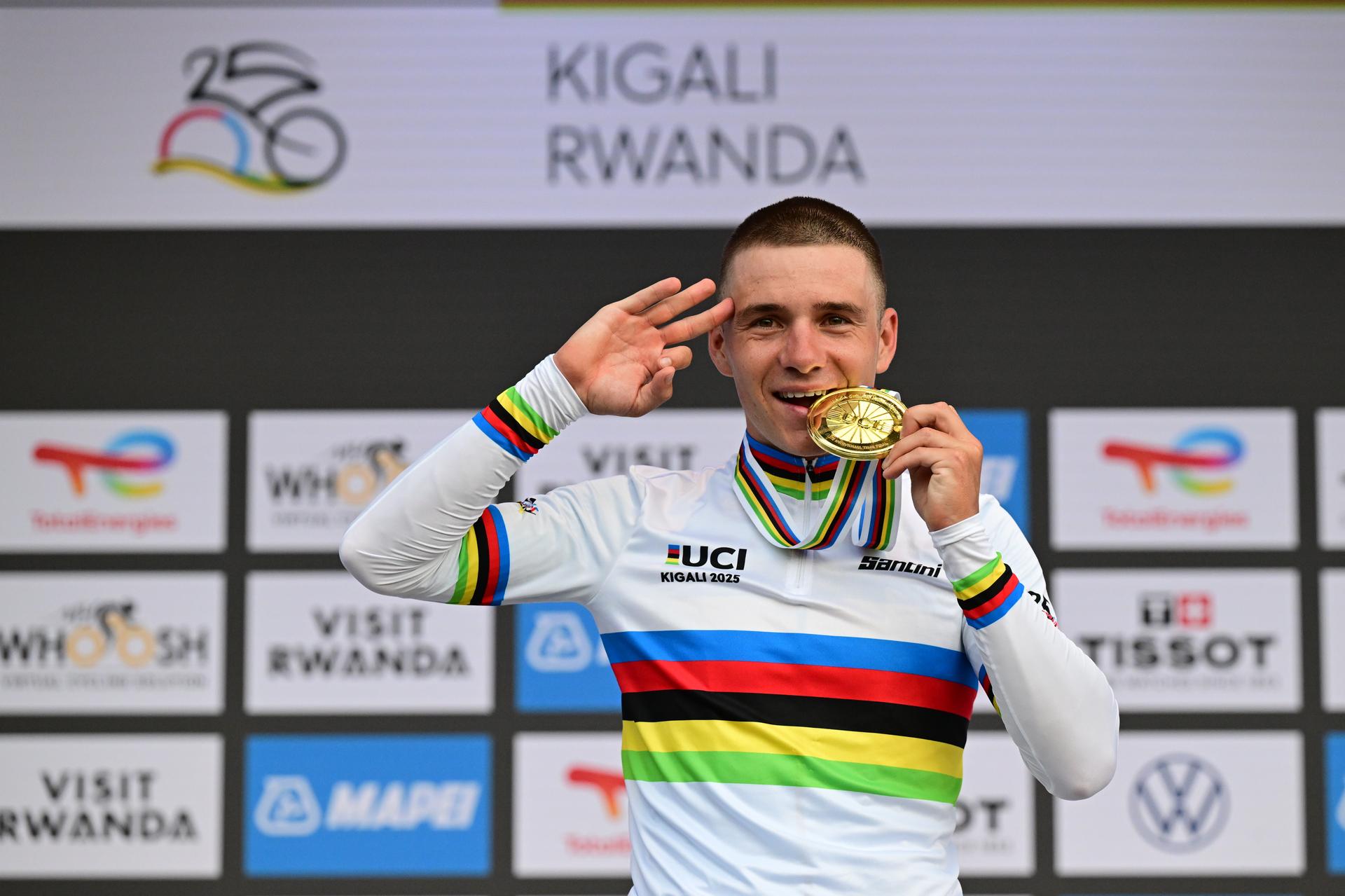 Gold medal winner world champion Belgian Remco Evenepoel celebrates his victory on the podium of the Men Elite Individual Time Trial race (40,8km) at the cycling road world championships, in Kigali, Rwanda, Sunday 21 September 2025. The 2025 UCI Road World Championships take place from 21 to 28 September in Kigali, Rwanda. BELGA PHOTO DIRK WAEM