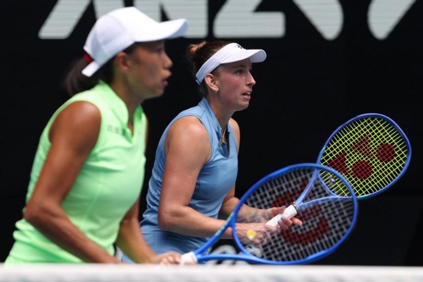 Belgium's Elise Mertens (R) waits for a shot beside partner China's Zhang Shuai during their women's doubles final match against Kazakhstan's Anna Danilina and Serbia's Aleksandra Krunic on day fourteen of the Australian Open tennis tournament in Melbourne on January 31, 2026.  DAVID GRAY / AFP