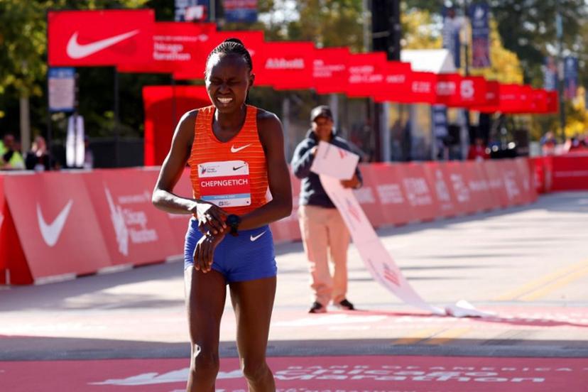 Kenya's Ruth Chepngetich reacts after crossing the finish line to place first in the women's division of the 2022 Bank of America Chicago Marathon in Chicago, Illinois, on October 9, 2022.  KAMIL KRZACZYNSKI / AFP
